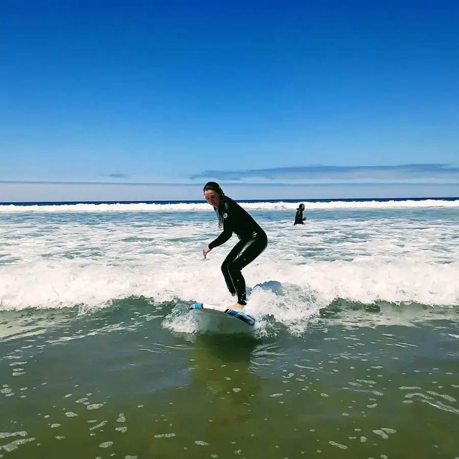 Surfer riding a wave at Pismo Beach